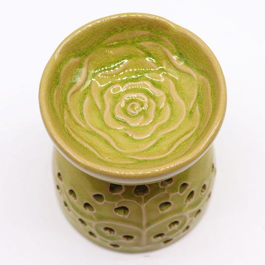 Green ceramic oil burner with floral cut out design