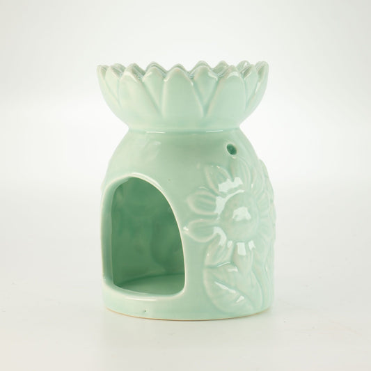 Ceramic sunflower oil burner in pastel green side view