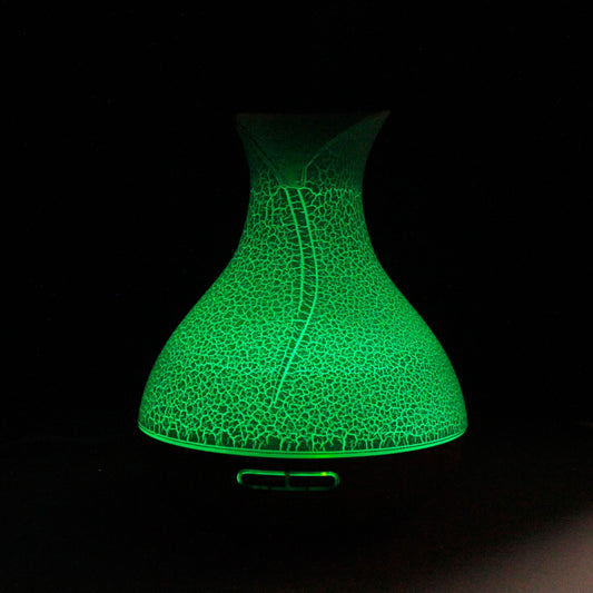 Palma Aroma Diffuser Shell Effect emitting a green light