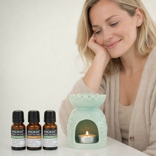 woman with her ceramic oil burner and 3 essential oils