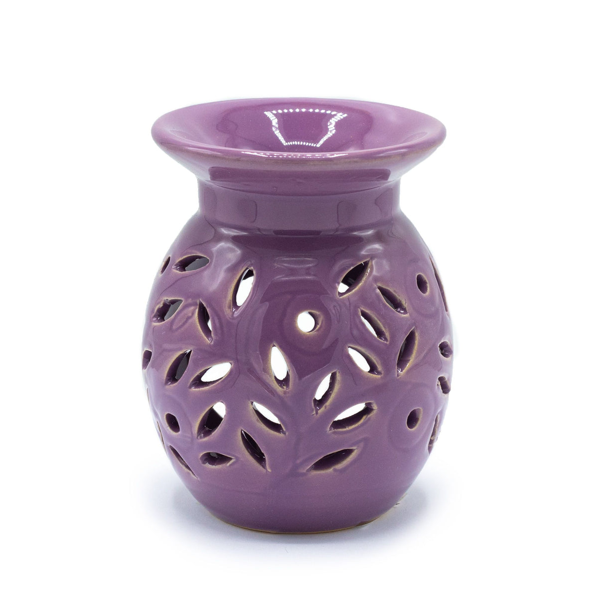 lavender ceramic oil burner with floral cutout design on a white background