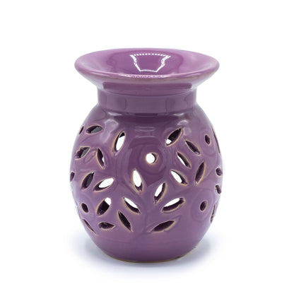lavender ceramic oil burner with floral cutout design on a white background