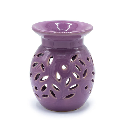 lavender ceramic oil burner with floral cutout design on a white background