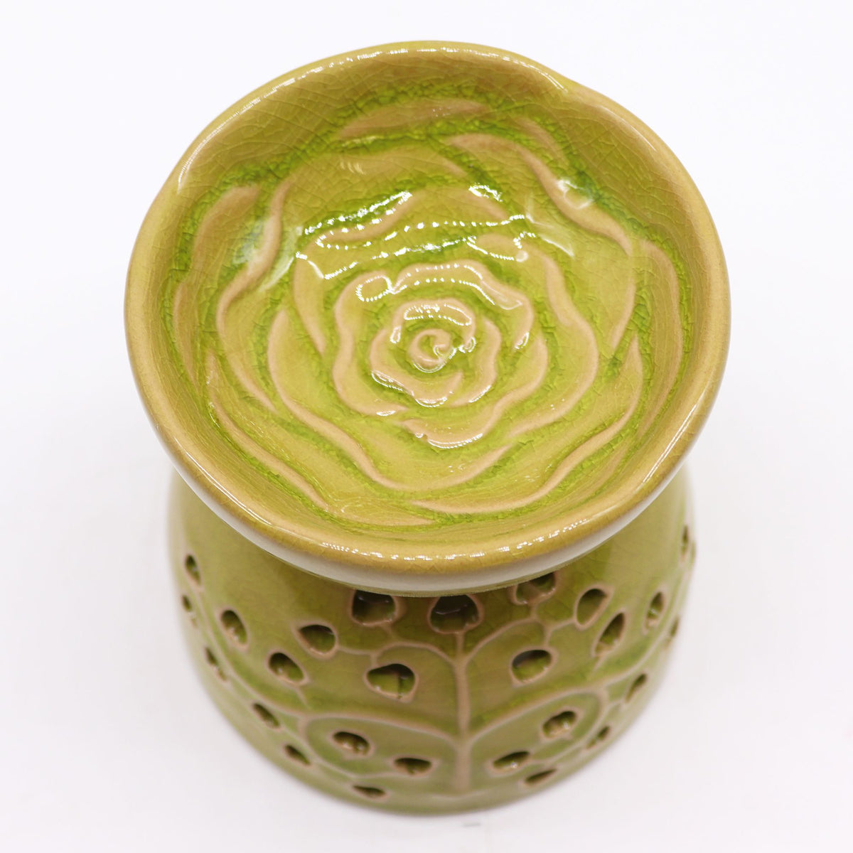 Green ceramic oil burner with floral cut out design