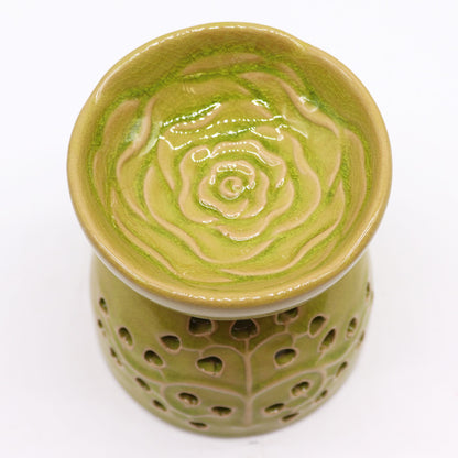 Green ceramic oil burner with floral cut out design