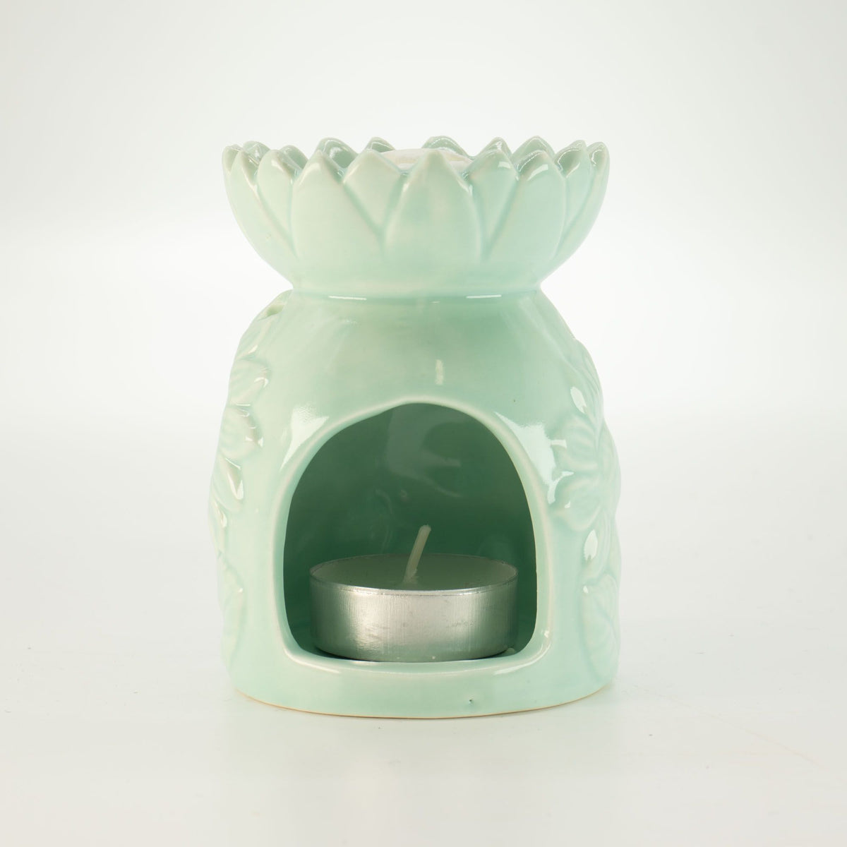 Ceramic sunflower oil burner in pastel green with tea light