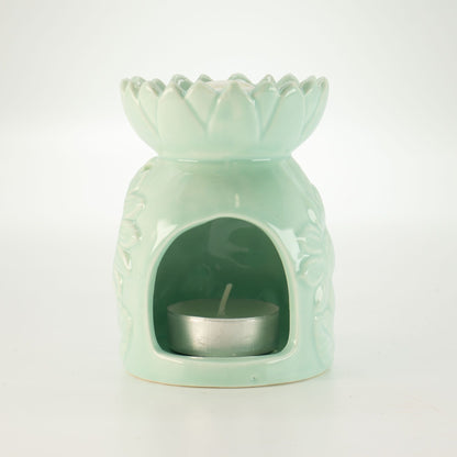 Ceramic sunflower oil burner in pastel green with tea light
