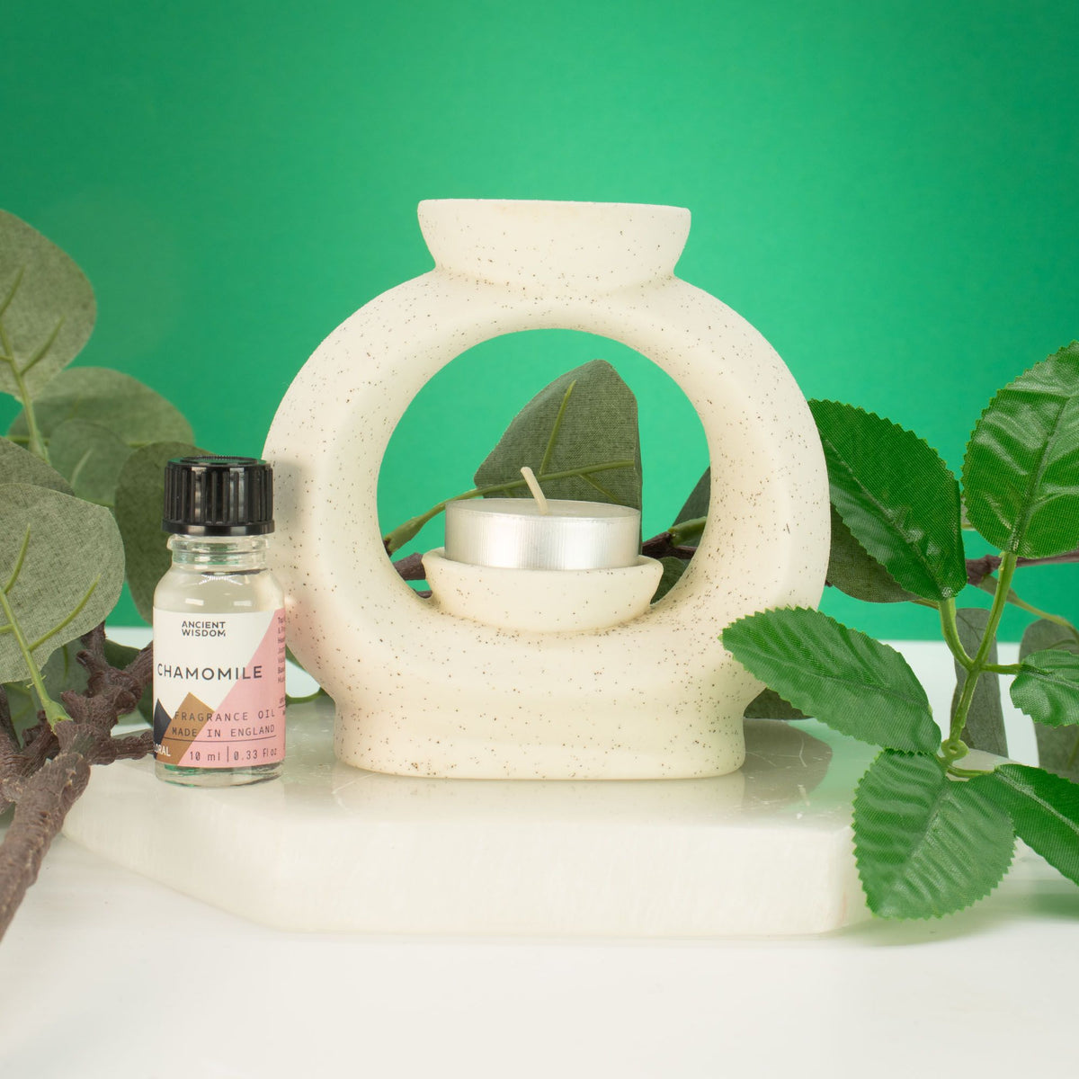 Ceramic Zen Oil Burner on table with tea light 