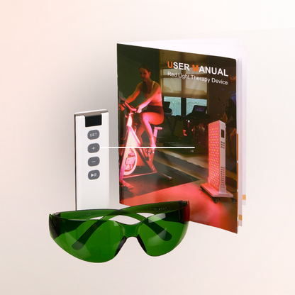 Red light therapy device with green safety glasses and user manual on a white background