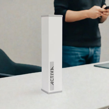 Geomack Activa EMF Harmoniser on a work desk near a mobile phone 