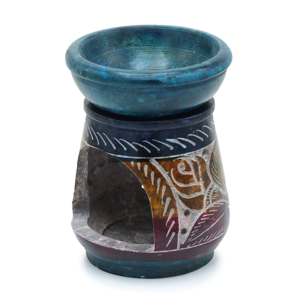 Soap stone oil burner with blue top and patterned base on a white background