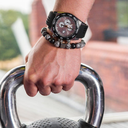 Training with a kettlebell wearing the Zen-Z Karma Grey Jasper Bracelet