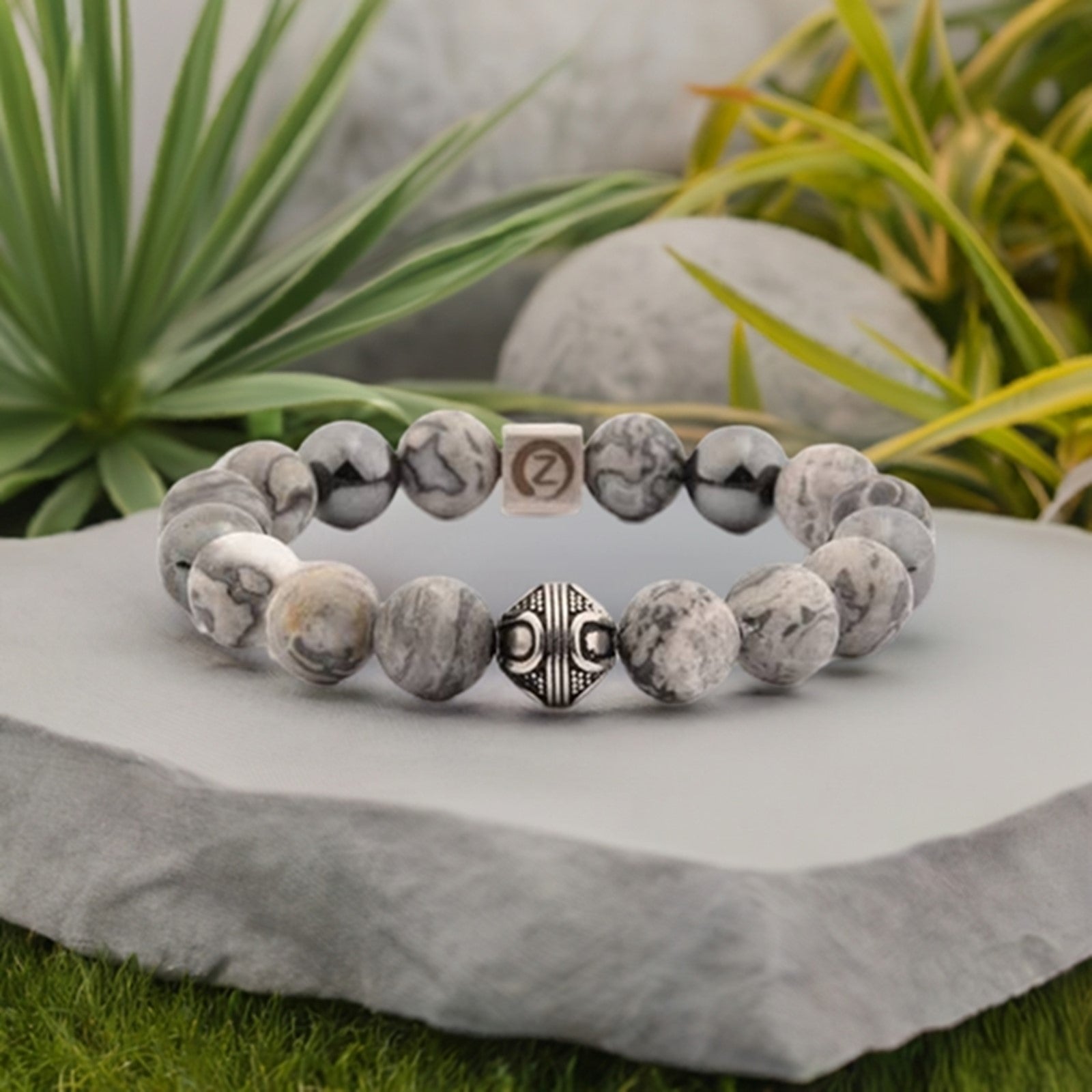 Zen-Z Karma Grey Jasper magnetic bracelet on a rock